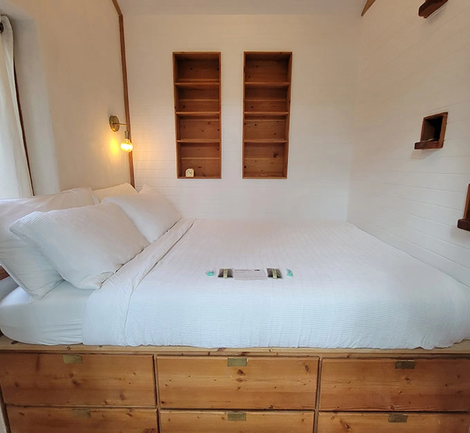 Bedroom with Built In Wood Bookshelves