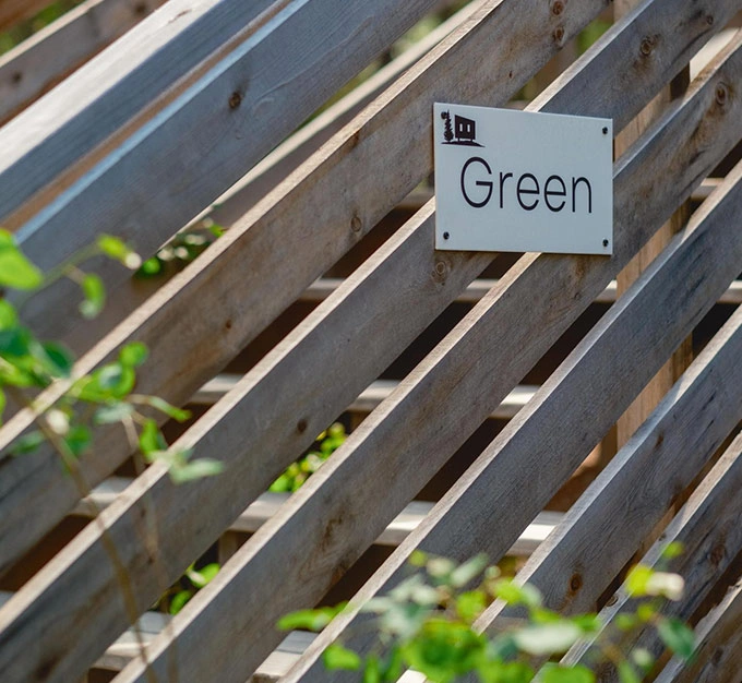 Green Cabin Sign and Entrance