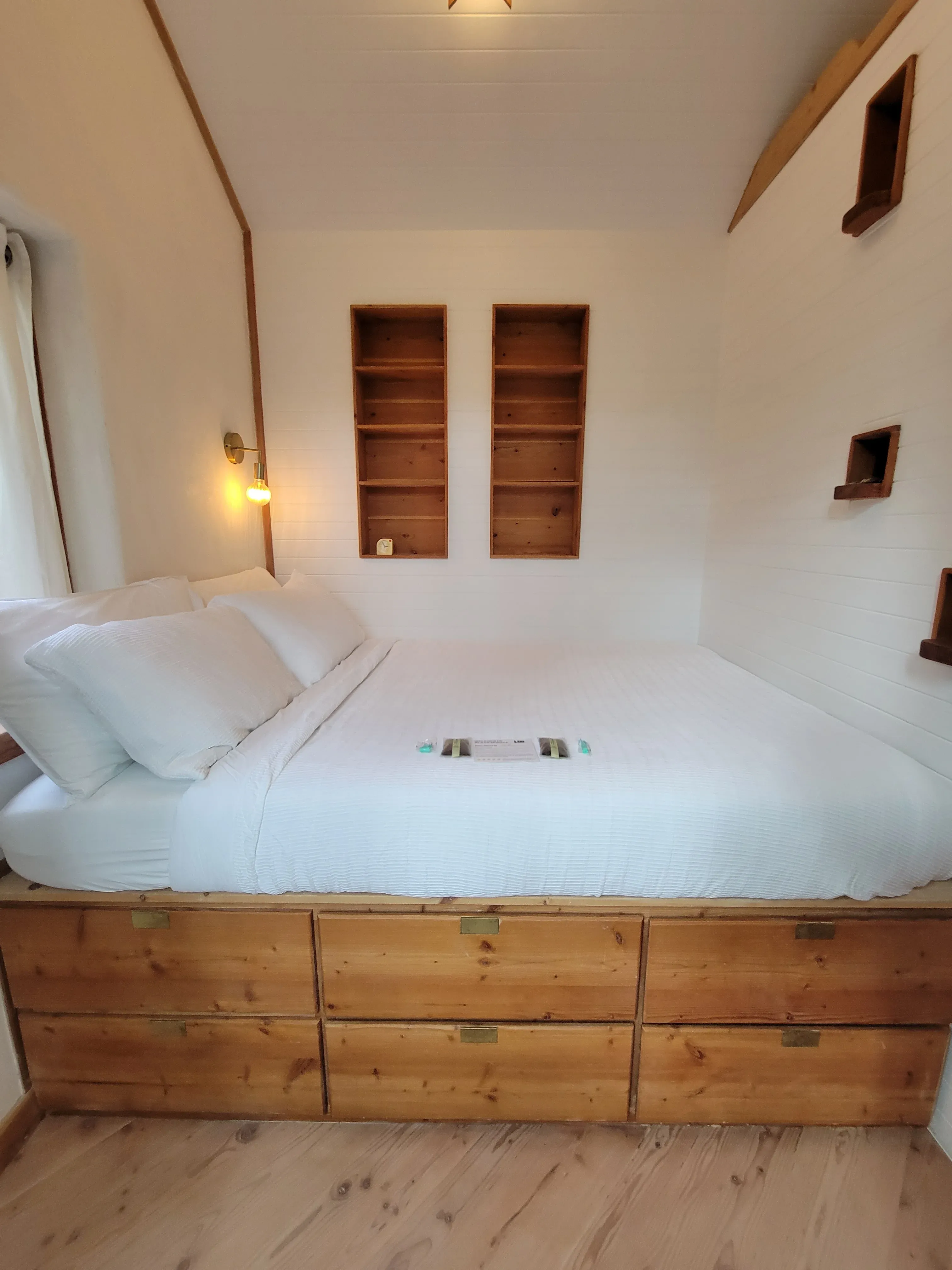 Bedroom with Built In Wood Bookshelves