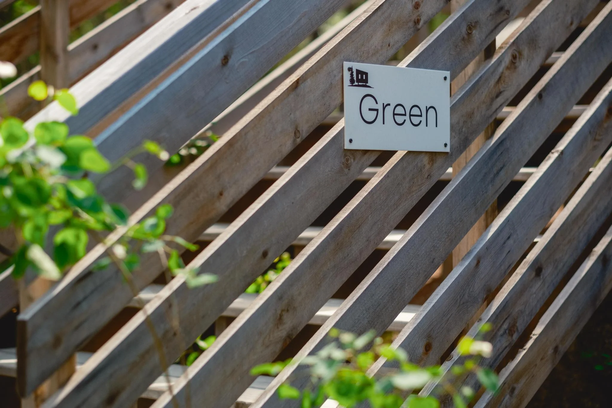 Green Cabin Sign and Entrance
