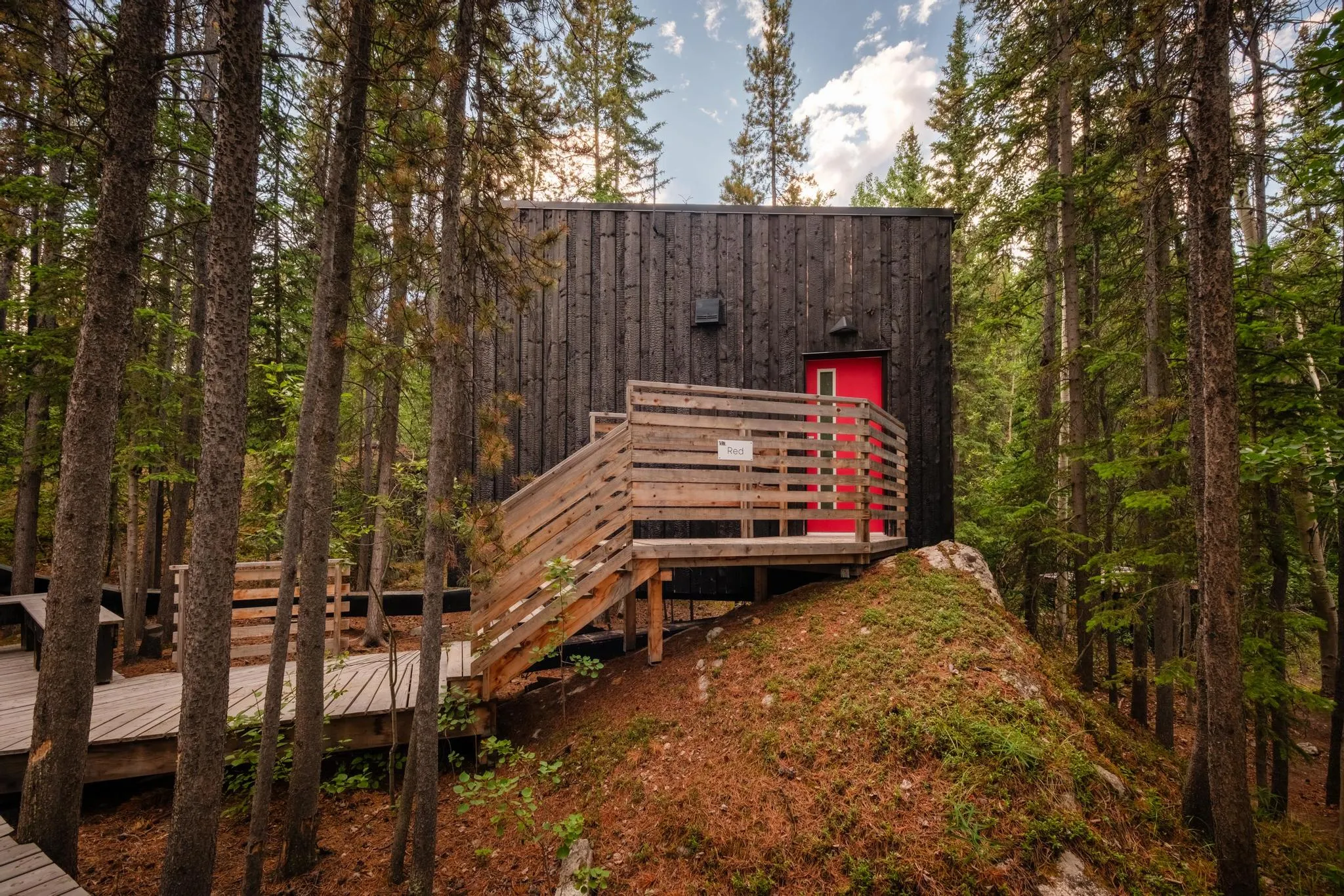 Red Cabin Surrounded by Yukon Forest