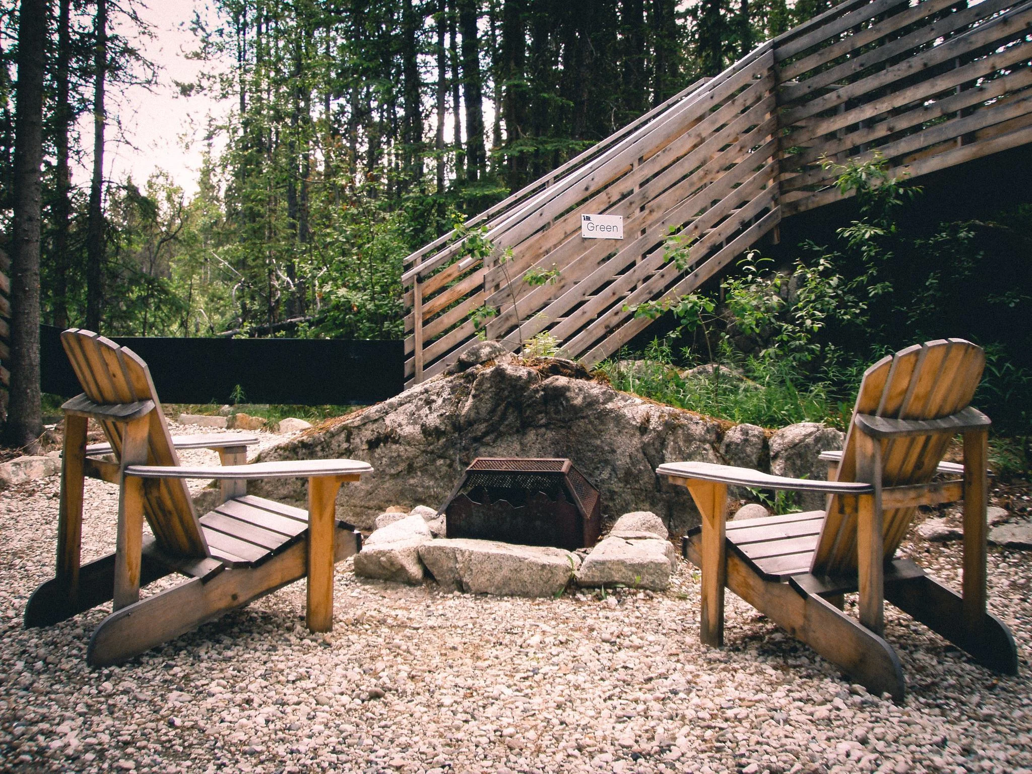 Fire Pit Beside a Forest Cabin